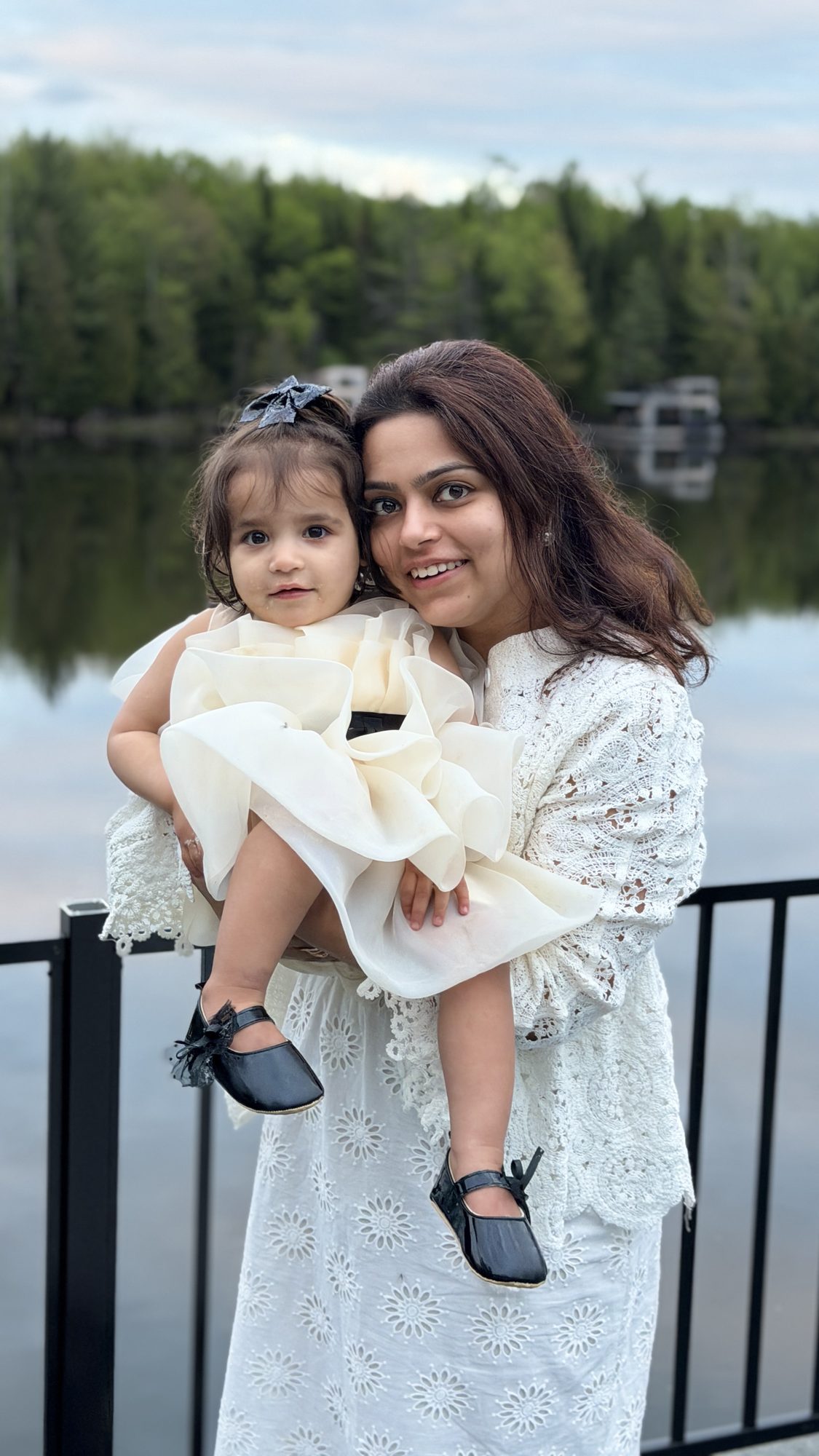 Mother and daughter by the lake